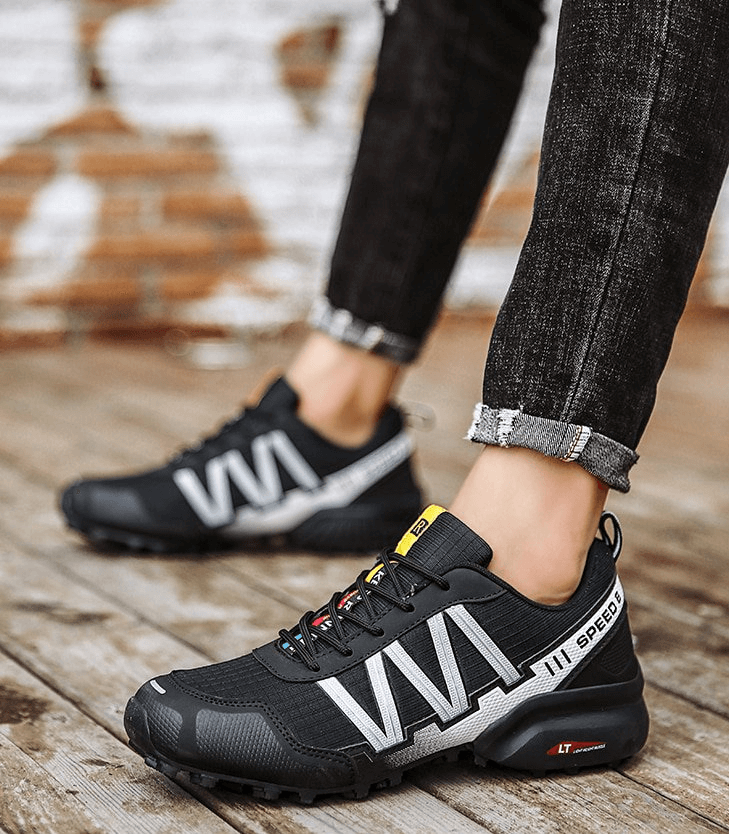 Stylish black waterproof men's sneakers with non-slip EVA outsole, ideal for sports and casual wear. Model SF0780 on wooden floor.